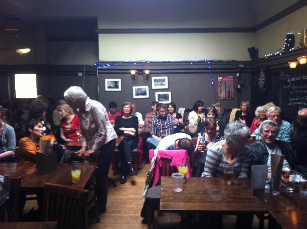 People filling up the back room